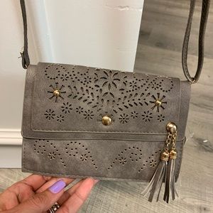 Gray adjustable crossbody bag..